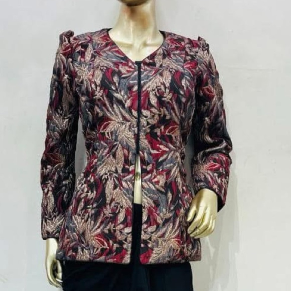 Brocade blouse with puff shoulders.